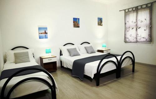 Ένα ή περισσότερα κρεβάτια σε δωμάτιο στο Residence Torre Saracena