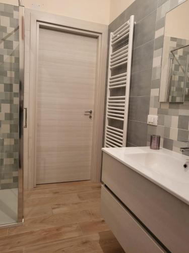 a bathroom with a shower and a sink and a mirror at Casa da Carmine a Tursi in Tursi