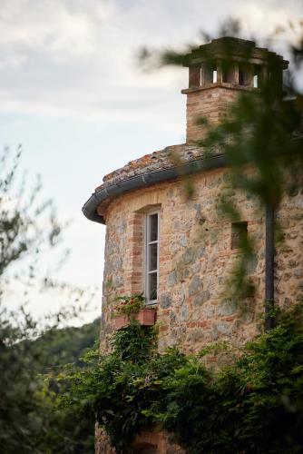 a brick building with a window on top of it at Antica Dimora in San Gimignano