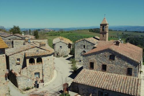 an aerial view of a village with a church at Antica Dimora in San Gimignano