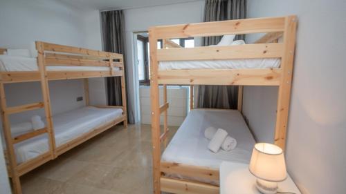 A bed or beds in a room at Marina Duquesa 951