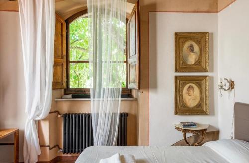 Ένα ή περισσότερα κρεβάτια σε δωμάτιο στο Villa San Filippo