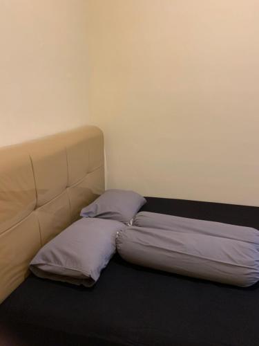 Säng eller sängar i ett rum på First Tasnim Village