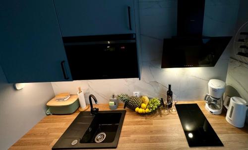 Kuchyňa alebo kuchynka v ubytovaní MiłoMi Apartamenty Kołobrzeg