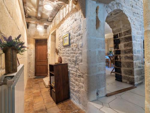 a hallway in a castle with a stone wall at Apartment Belles Pierres by Interhome in Calvisson