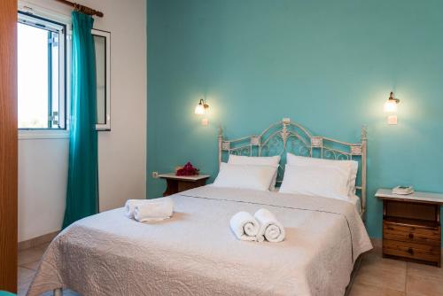 Ένα ή περισσότερα κρεβάτια σε δωμάτιο στο Nemorosa Holiday Houses