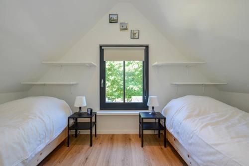 Postel nebo postele na pokoji v ubytování Villa Goudvink
