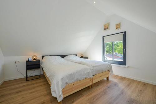 Ένα ή περισσότερα κρεβάτια σε δωμάτιο στο Villa Goudvink