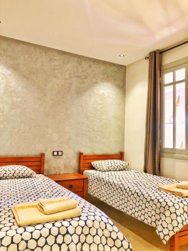 Postel nebo postele na pokoji v ubytování Magnifique Duplex En Plein Hivernage à Marrakech