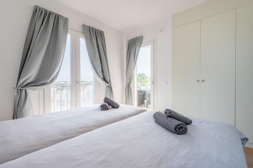 Postel nebo postele na pokoji v ubytování Vivienda liv El Puerto I 3-11