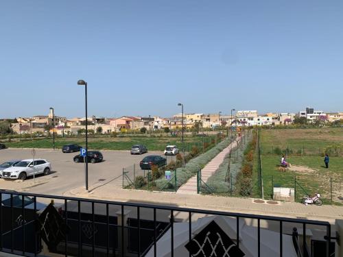 a parking lot with cars parked in a parking lot at Piccola residenza del parco in Quartucciu