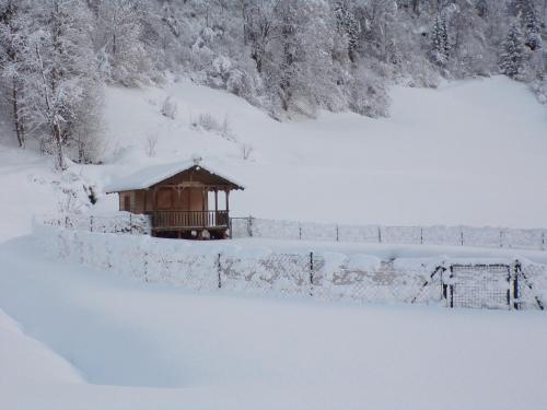 a gazebo in a field covered in snow at Ferienwohnung Moharblick 2 in Großkirchheim