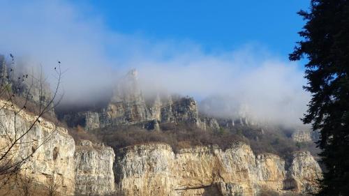 a mountain with clouds on top of it at Къща за гости Марчела и Ресторант Мъри in Gara Lakatnik