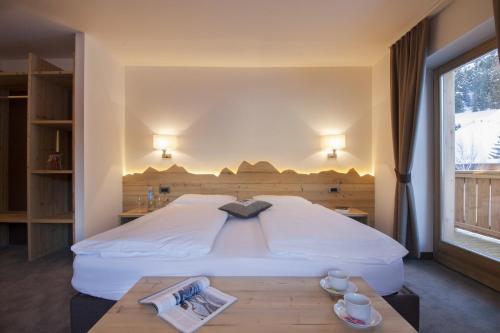 Ein Bett oder Betten in einem Zimmer der Unterkunft Hotel Garni Lastei