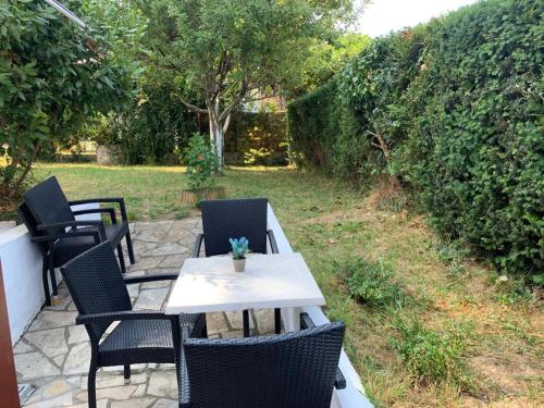 a table and chairs sitting on a patio at HENDAYE PLAGE (850m) APPARTEMENT 1-4 PERSONNES in Hendaye