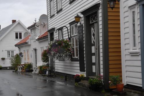 a row of houses on a rainy street at Sogndalstrand Kulturhotell in Sogndalsstrand