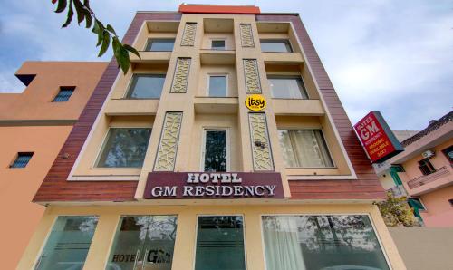 a building with a sign that reads local gin residency at Itsy By Treebo - GM Residency in Chandīgarh