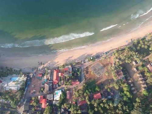 an aerial view of a beach and the ocean at Valerys Nest Bogmalo - Private villa near the beach and Dabolim airport in Bogmolo