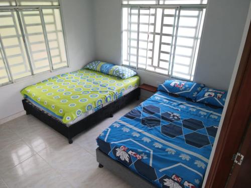 מיטה או מיטות בחדר ב-VILLA DON JUAN