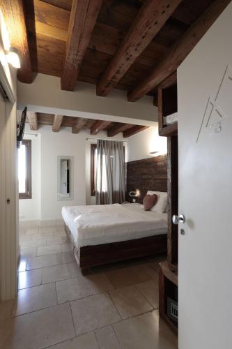 Ένα ή περισσότερα κρεβάτια σε δωμάτιο στο Hotel Antica Abbazia
