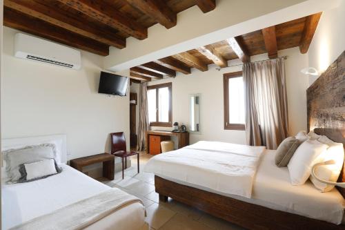 Ένα ή περισσότερα κρεβάτια σε δωμάτιο στο Hotel Antica Abbazia