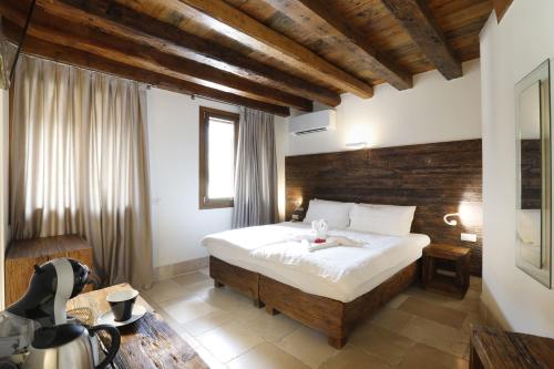 Ένα ή περισσότερα κρεβάτια σε δωμάτιο στο Hotel Antica Abbazia