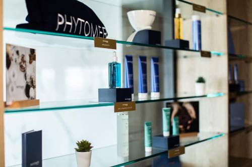 a shelf with products on it in a store at Le Barracuda & Spa, Centre Port, pieds dans l'eau, vue mer in Brest