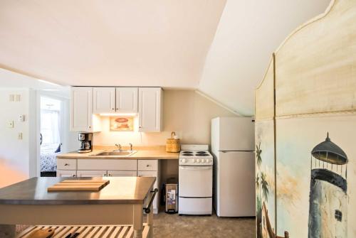 a kitchen with a white refrigerator and a table at Manchester Center Retreat with Mtn View, Near Skiing in Manchester Center