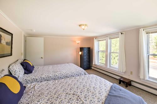 a bedroom with two beds and two windows at Manchester Center Retreat with Mtn View, Near Skiing in Manchester Center