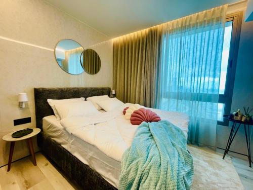 Postel nebo postele na pokoji v ubytování C Tower Apartments