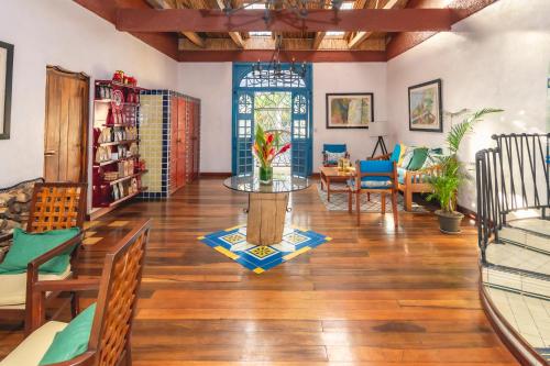 a living room with a table and chairs at Finca Rosa Blanca Coffee Farm and Inn in Heredia