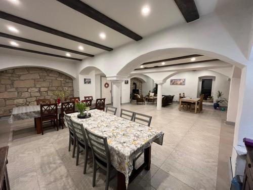a dining room with a table and chairs at Lawendowa Stajnia in Lwówek Śląski