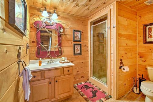 a bathroom with a sink and a shower and a toilet at Lake Hartwell Lodge with Dock, Theater and Hot Tub! in South Union