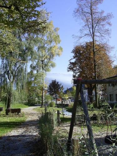 a swing set in a park with trees at Privatzimmer Bundschuh in Amlach