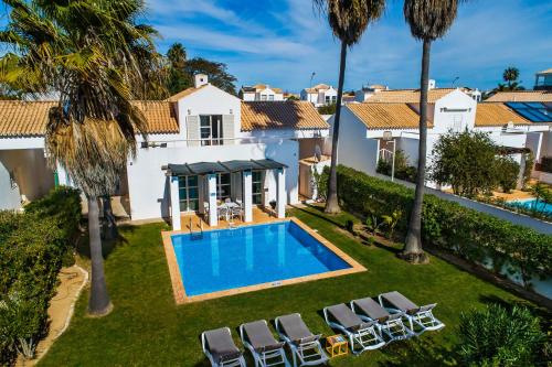 an aerial view of a villa with a swimming pool at Villa Luz do Atlantico by OCvillas in Galé
