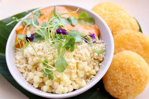a bowl of rice and vegetables on a plate at Finca Rosa Blanca Coffee Farm and Inn in Heredia