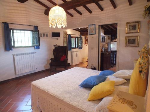 a room with a bed with pillows on it at Pian De' Somari in Pitigliano