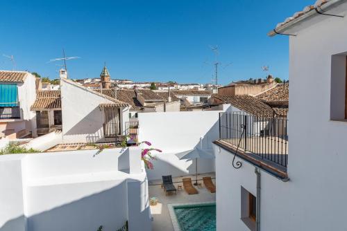 a view from the balcony of a house with white buildings at Hostal Aljibe in Archidona