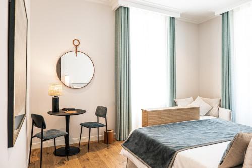 Postel nebo postele na pokoji v ubytování Hôtel Le Mosaïque