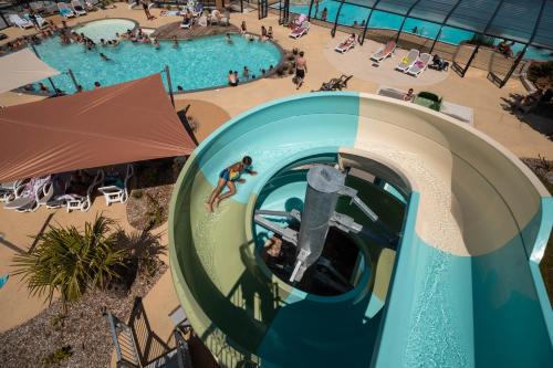 an overhead view of a water slide at a pool at Camping Les Alizés in Saint-Hilaire-de-Riez