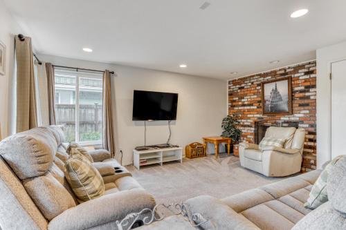 a living room with two couches and a tv at Ocean Vista Vacation Home in Seaside