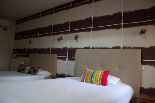 Cama o camas de una habitación en Hôtel Absolu