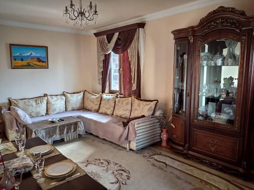 a living room with a couch and a table at Morik 's & Tours in Yerevan