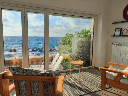 a room with a view of the ocean at Marina Holiday Home in Pizzo