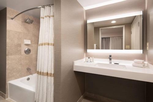 a bathroom with a sink and a mirror at Monterey Marriott in Monterey