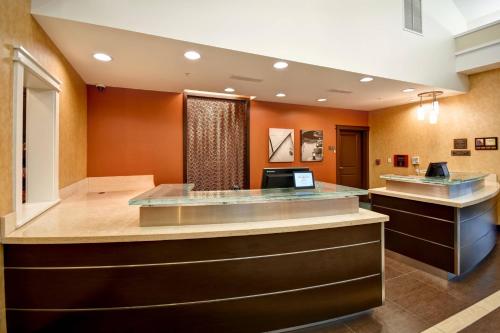a lobby of a hospital with a reception counter at Residence Inn by Marriott Springfield Chicopee in Chicopee