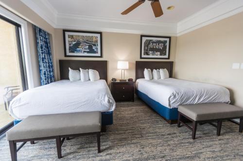 a hotel room with two beds and a window at Camden on the Lake Resort in Lake Ozark