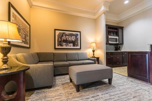 a living room with a couch and a table at Camden on the Lake Resort in Lake Ozark