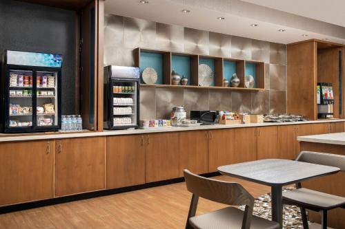 a fast food restaurant with a counter and chairs at SpringHill Suites by Marriott Huntsville West/Research Park in Huntsville