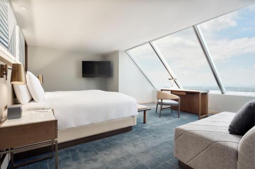 a hotel room with a bed and a couch at JW Marriott Hotel Mexico City Polanco in Mexico City